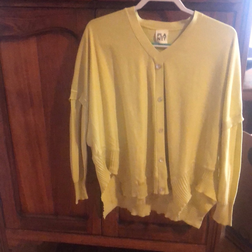 Planet lime green yellow asymmetrical sweater. It’s funky. One size fits all